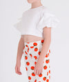 white blouse with balloon sleeves and matching pants with tomato prints