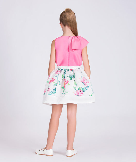 pink blouse and white floral skirt