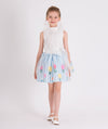 white organza blouse with blue and white striped skirt that has colorful flower prints