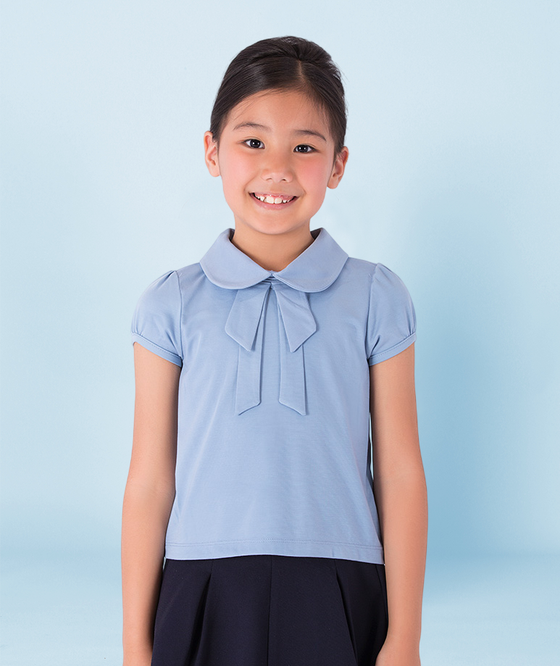 a light blue collared top with a bow detail