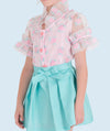 Delicate floral sheer blouse for girls with pastel pink and blue rose patterns, featuring ruffled sleeves and a bow collar for a whimsical, vintage look