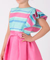 blue striped ruffled blouse and pink skirt 