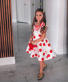 ecru tomato printed dress with a striped bow on the shoulder