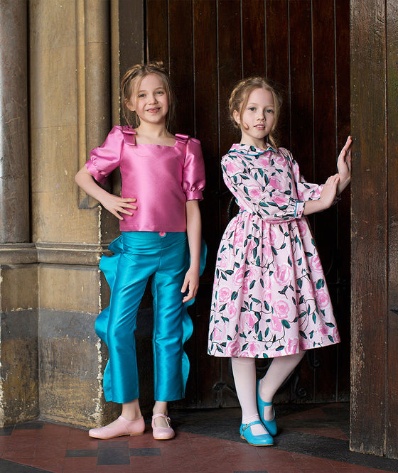 fuschia blouse and blue ruffled pants, pink floral dress